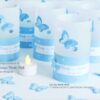 Windlichthüllen Tischlicht-Hüllen für Teelichter mit 3D-Schmetterlingen und personalisiertem Text auf unterem Papierstreifen in blau. Handgefertigt aus 115g Transparentpapier. Hüllen mit gestanzten Sternen. © KARTEN-DESIGN.at